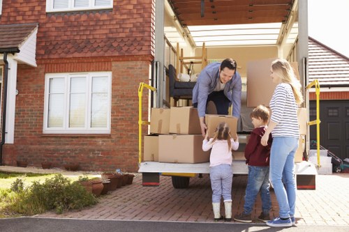 Removal team planning a move in Bayswater with packed boxes and furniture
