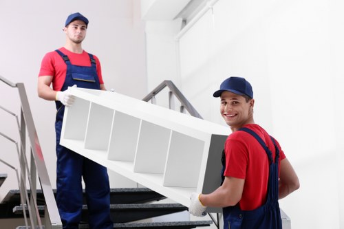 Furniture pick-up service removing a sofa in Bayswater