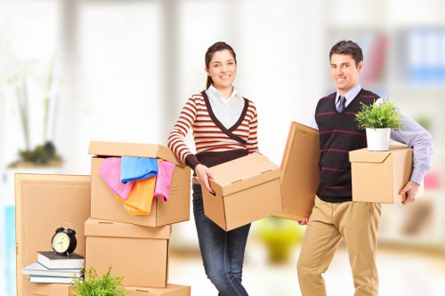 Professional movers handling office technology during commercial moves in Bayswater