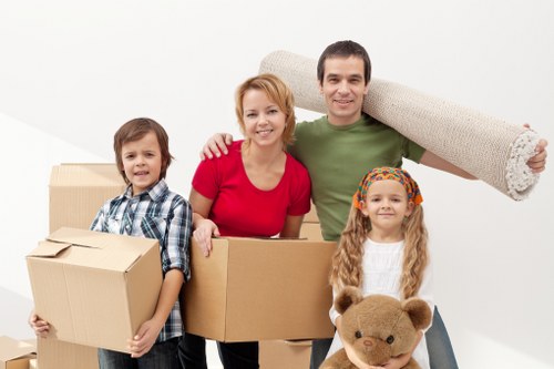 Professional movers loading items into a van in Bayswater