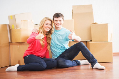 Packed moving boxes ready for transport in a Bayswater flat