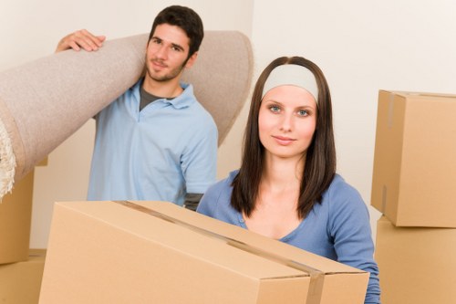 Packed boxes and furniture ready for house removals in a Bayswater apartment