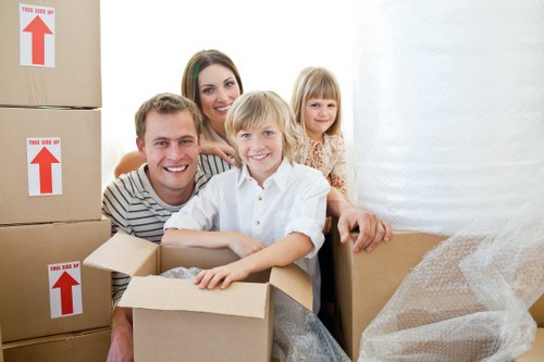Moving team navigating a Bayswater home with tight access