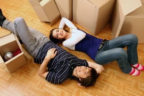 Professional man and van loading furniture in Bayswater